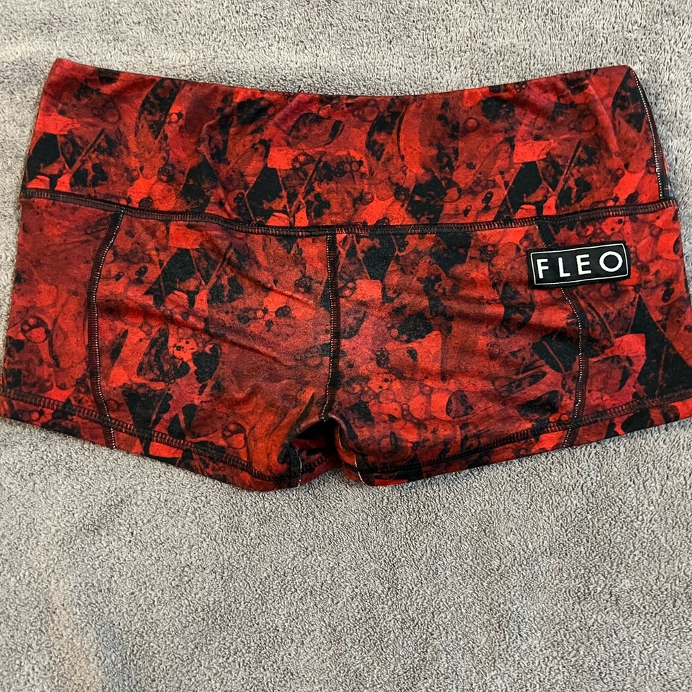 Red and black Fleo shorts. Size Mefium. Rarely worn.